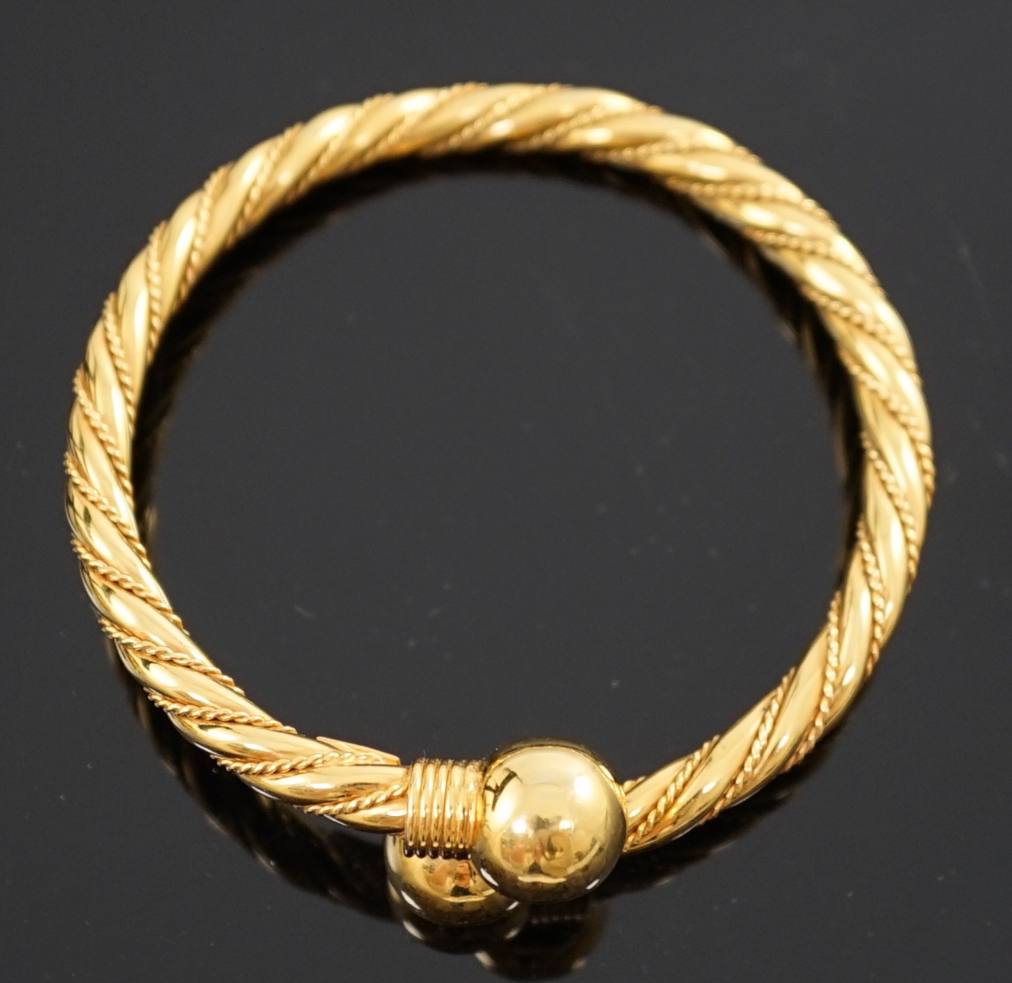 A modern Italian 18k gold open work bangle